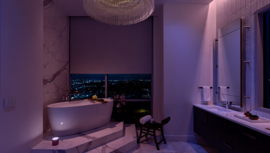 high-end bathroom illuminated with blue and purple lighting to enhance relaxation