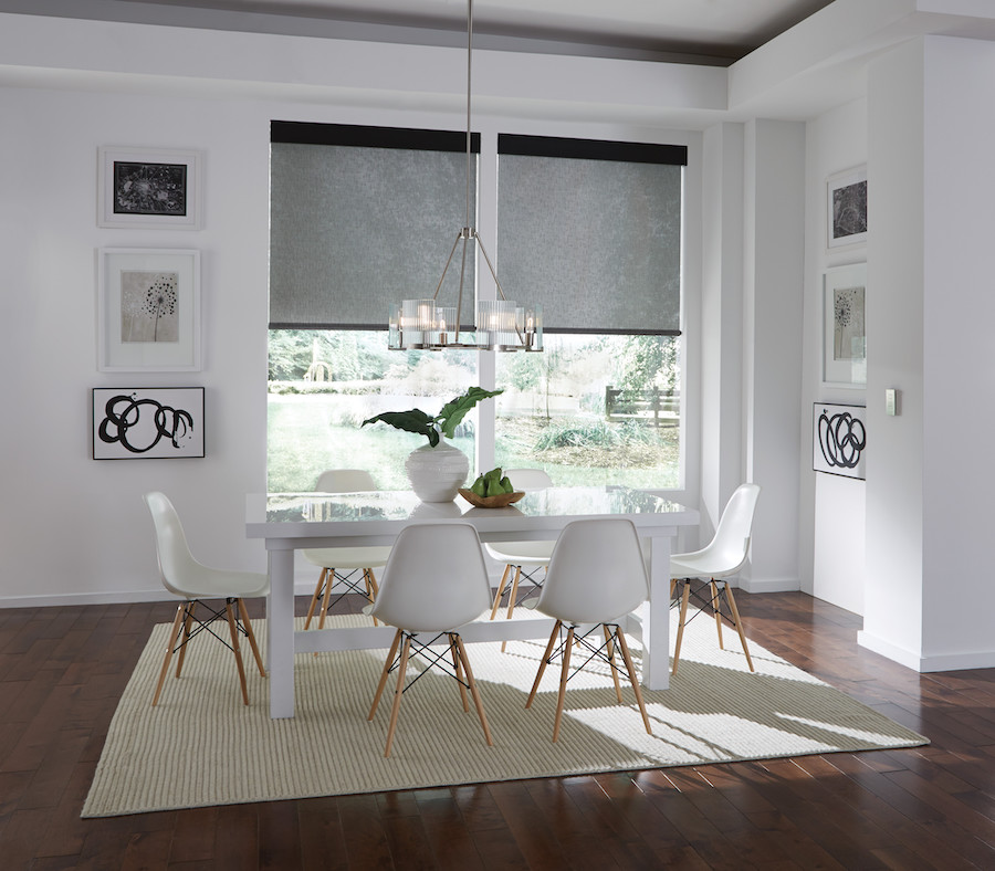 Image is of a modern home with wood blinds on each window